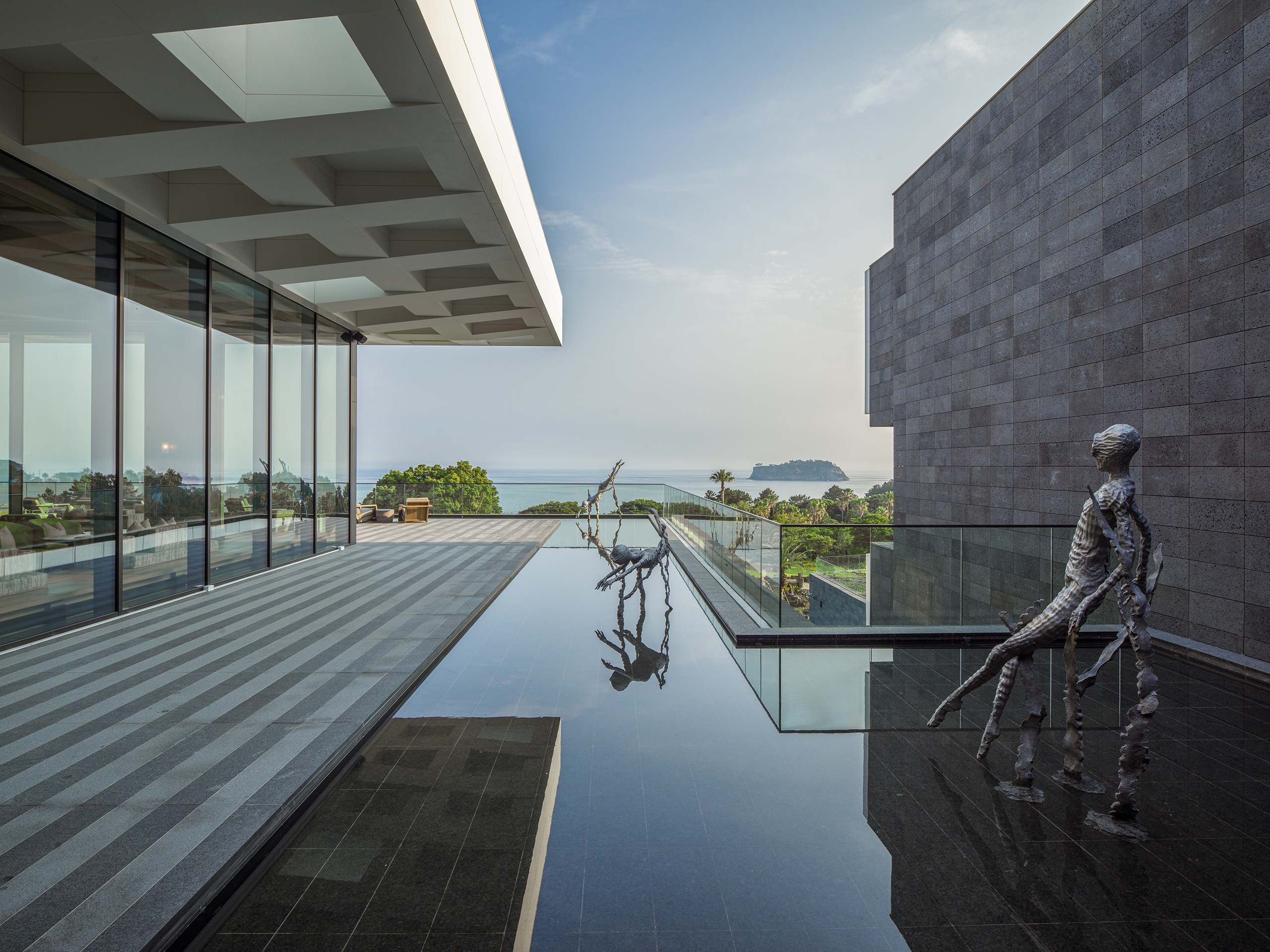 JW Marriott Jeju architecture with pond and sculptures